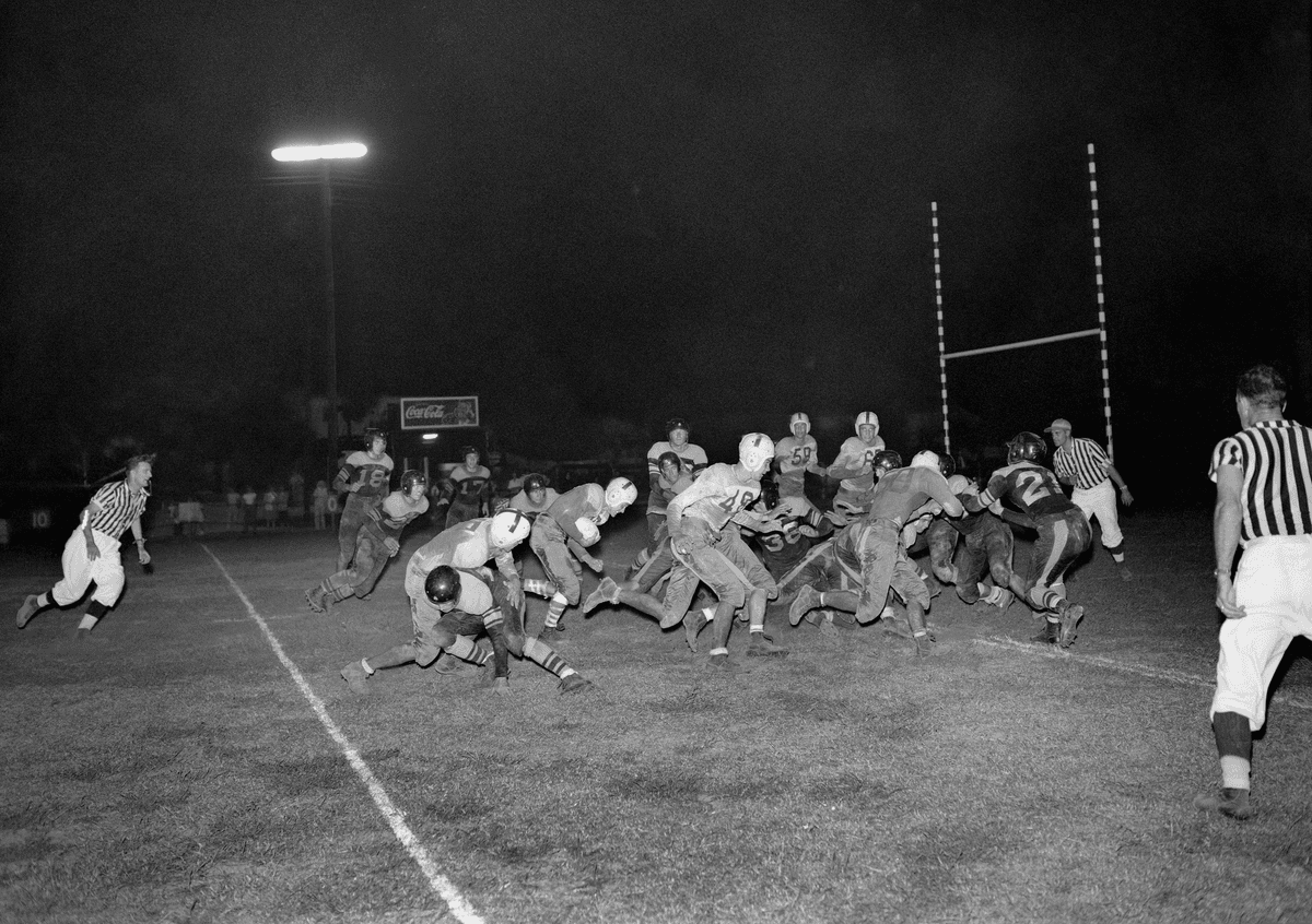 Soldiers playing football at Oak Ridge, 1947
